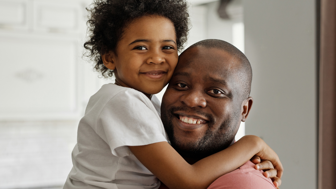 Father and child sharing a warm embrace, demonstrating connection and trust